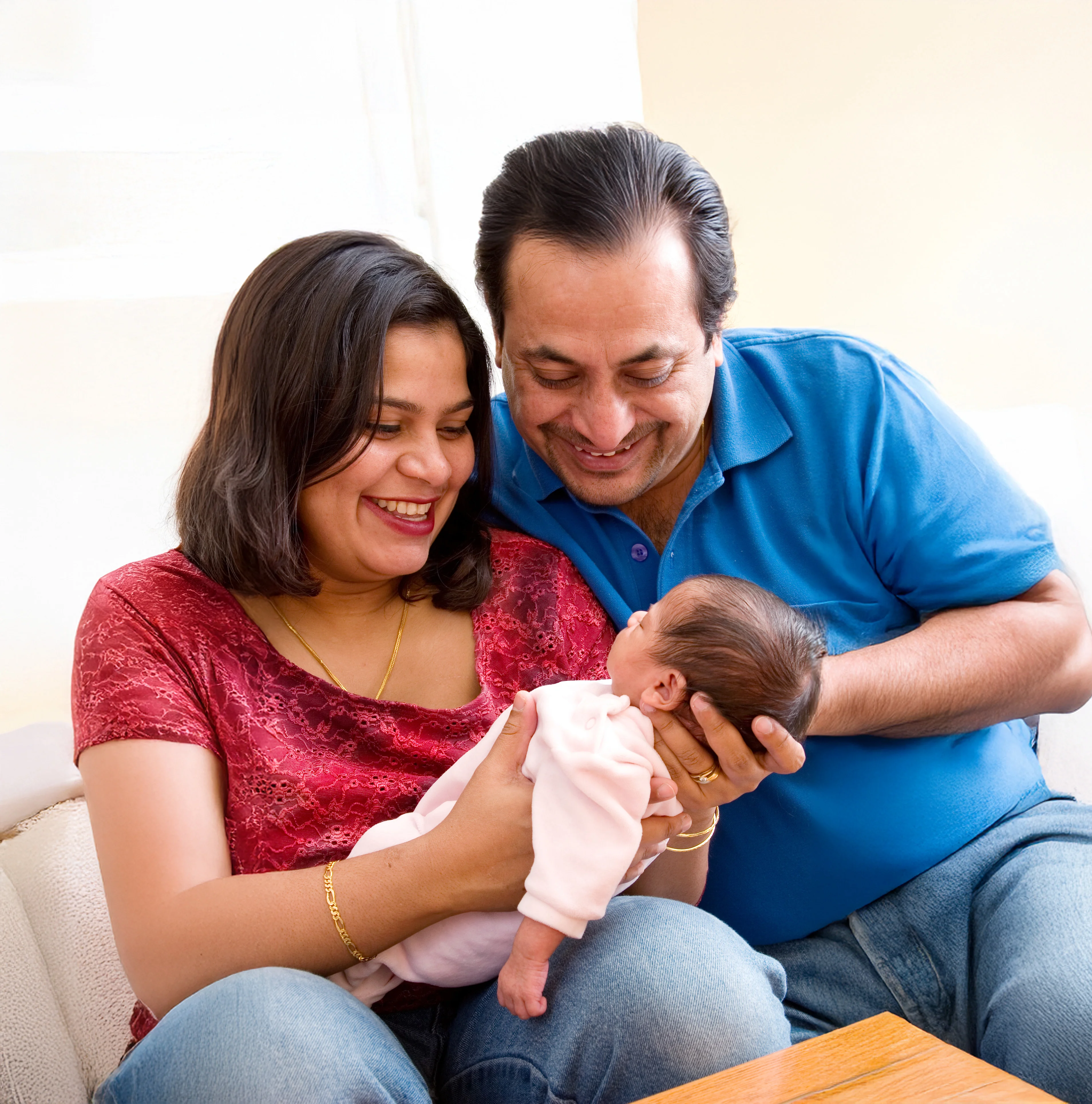 Couple holding newborn baby