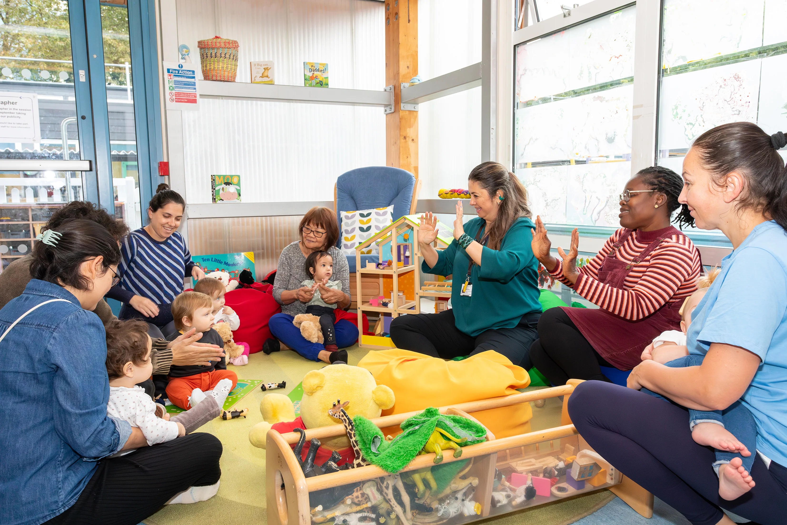 Parents and carers with babies at a stay and play session.